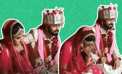 Groom puts hand on bride wedding