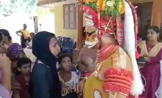 Viral Video Of Theyyam Artiste In Kerala Comforting And Blessing Muslim Woman Is Winning Hearts