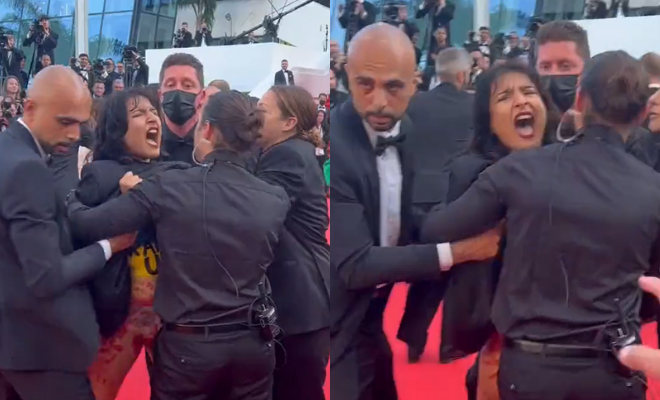 Woman Crashes Cannes Film Festival, Strips And Screams On Red Carpet In Ukraine Colours