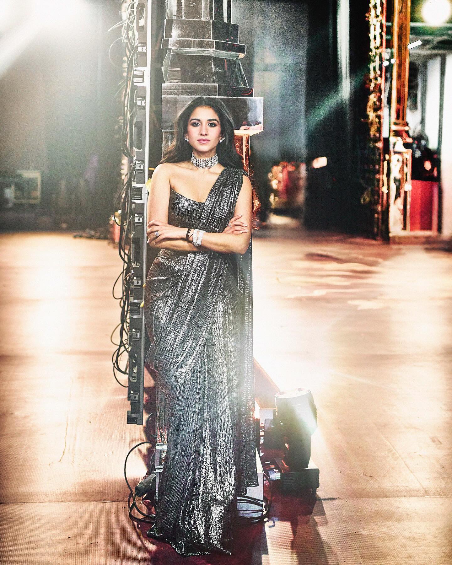 Radhika Merchant has been making waves with her impeccable fashion choices during her pre-wedding celebrations. The soon-to-be Ambani bahu dazzled everyone once again with her second look at the sangeet ceremony, stepping out in a glittering Manish Malhotra saree that exemplified glamour and elegance. Internet Fashion police Diet Sabya took to their Instagram to share the pictures of Radhika, Radhika Merchant, who initially wowed in an Abu Jani Sandeep Khosla lehenga, chose a Manish Malhotra saree for her second appearance at the sangeet. Known for his expertise in sequined designs, Manish Malhotra created a masterpiece for Radhika, showcasing his unique chainmail pattern. The saree, in a captivating shade of black, was paired with a matching off-shoulder corset blouse that perfectly complemented the ensemble. Radhika’s saree was styled by Rhea Kapoor. To enhance the look, she accessorized with luxurious diamond jewellery, including a choker necklace, stacked bracelets, and statement stud earrings. Her makeup was equally glamorous, featuring smokey eyeshadow, smudged kajal, darkened brows, mascara-coated lashes, blushed cheeks, luminous highlighter, and nude lipstick. Her hair, styled in soft curls and parted in the middle, cascaded down her shoulders, completing her stunning look. Diet Sabya, a popular fashion critique platform on Instagram, shared exclusive photos of her look, highlighting the unique chainmail pattern of the saree. More Details On Anant Ambani, Radhika Merchant's Wedding Anant Ambani and Radhika Merchant, both aged 29, are set to tie the knot in a grand celebration in Mumbai. The wedding festivities will span three days, starting on July 12 with the 'Shubh Vivaah' ceremony. This will be followed by the 'Shubh Aashirwad' on July 13, and the 'Mangal Utsav' on July 14, which will serve as the wedding reception. The sangeet ceremony was celebrated on July 5 and was attended by celebs like Salman Khan, Deepika Padukone, Ranveer Singh, Janhvi Kapoor, Shanaya Kapoor, Ananya Pandey, Orry and more. 